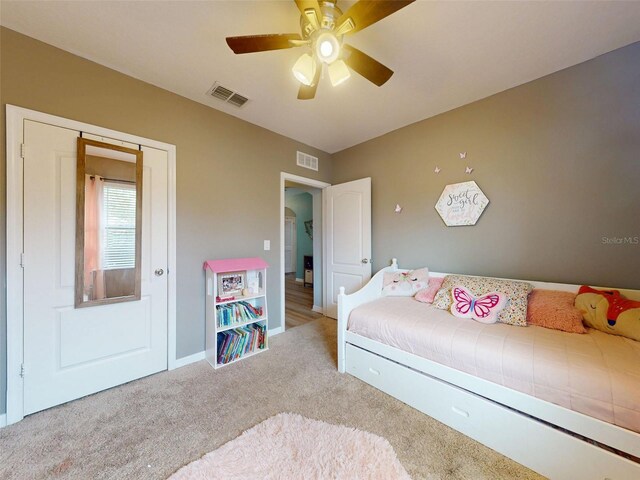 2731 Star Coral Ln, New Smyrna Beach, FL 32168 - carpeted bedroom with ceiling fan and baseboards