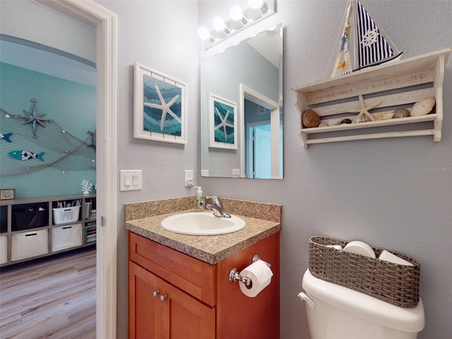 2731 Star Coral Ln, New Smyrna Beach, FL 32168 - half bath featuring vanity and wood finished floors