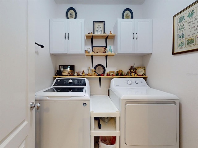 2731 Star Coral Ln, New Smyrna Beach, FL 32168 - washroom with washing machine and dryer and cabinet space