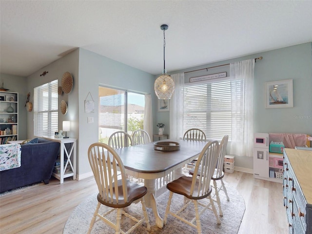 2731 Star Coral Ln, New Smyrna Beach, FL 32168 - dining room with light wood-style floors and baseboards