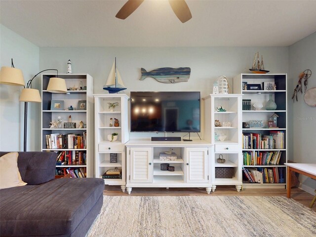 2731 Star Coral Ln, New Smyrna Beach, FL 32168 - living area featuring wood finished floors and a ceiling fan