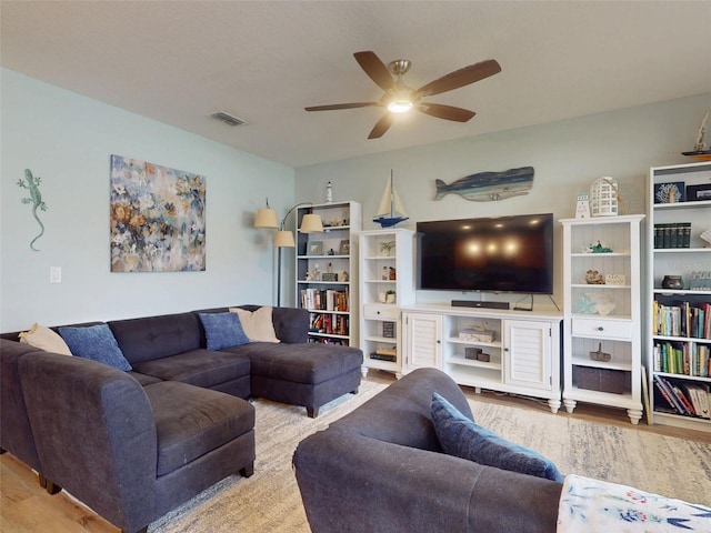 2731 Star Coral Ln, New Smyrna Beach, FL 32168 - living room featuring a ceiling fan and wood finished floors