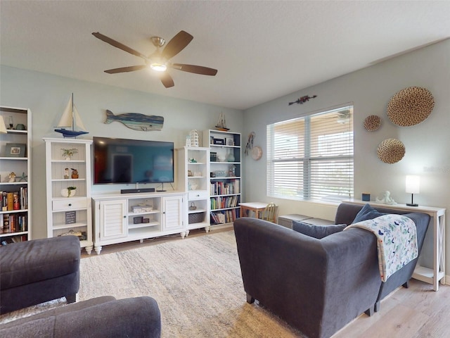 2731 Star Coral Ln, New Smyrna Beach, FL 32168 - living room with ceiling fan and wood finished floors