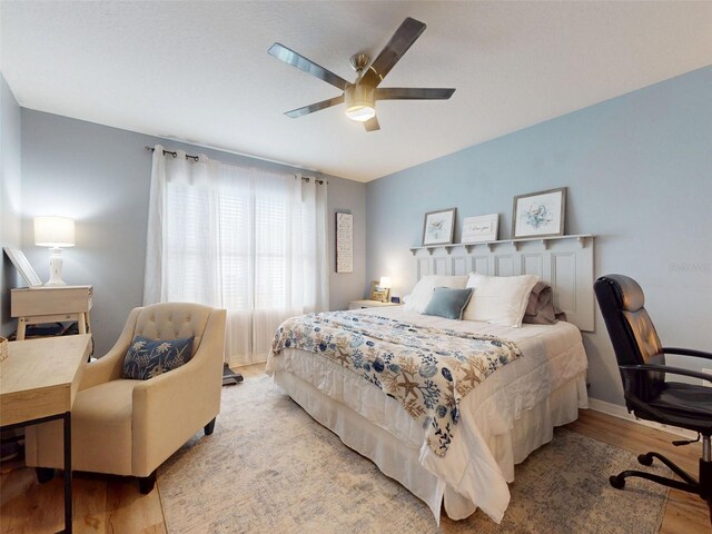2731 Star Coral Ln, New Smyrna Beach, FL 32168 - bedroom with wood finished floors and ceiling fan