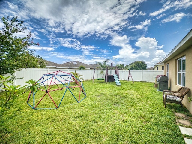 2731 Star Coral Ln, New Smyrna Beach, FL 32168 - fenced backyard featuring a playground