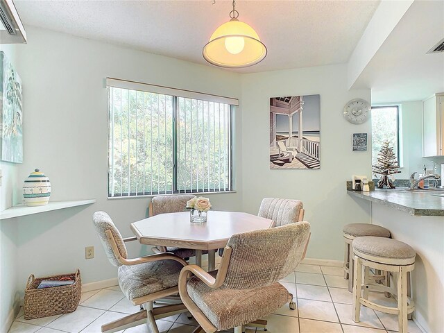 13 Surrey Ct Unit 13, Palm Coast, FL 32137 - dining room with light tile patterned floors