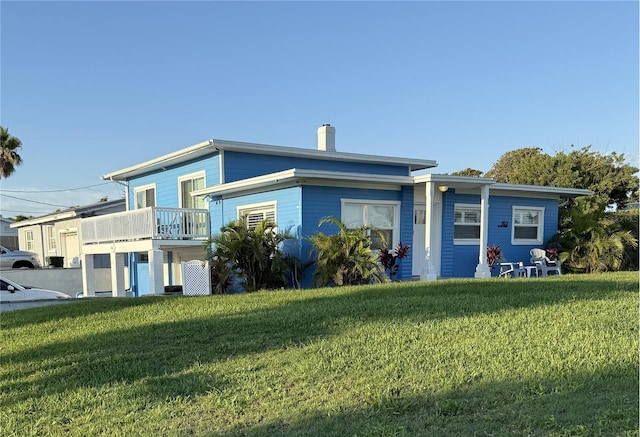 102 Moore Ave, Daytona Beach, FL 32118 - view of front of property with a front lawn and a chimney
