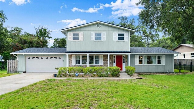 20 Putnam Ave, Ormond Beach, FL 32174 - traditional-style home featuring an attached garage, driveway, a porch, and roof with shingles
