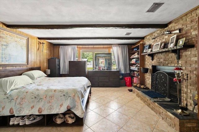 20 Putnam Ave, Ormond Beach, FL 32174 - bedroom featuring beamed ceiling, wood walls, a fireplace, and tile patterned flooring