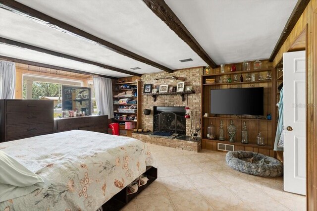 20 Putnam Ave, Ormond Beach, FL 32174 - bedroom with beam ceiling and a brick fireplace