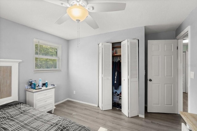 20 Putnam Ave, Ormond Beach, FL 32174 - bedroom with wood finished floors, a closet, and a ceiling fan