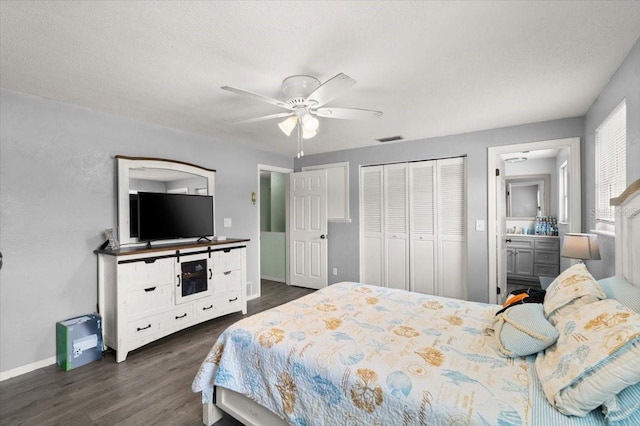 20 Putnam Ave, Ormond Beach, FL 32174 - bedroom featuring dark wood-style floors, a closet, ceiling fan, and a textured ceiling