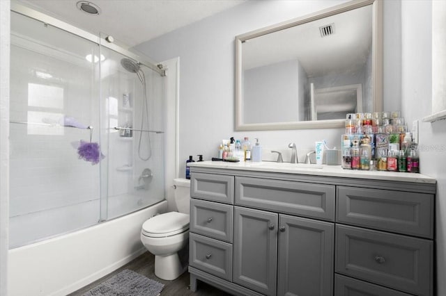 20 Putnam Ave, Ormond Beach, FL 32174 - bathroom featuring vanity, wood finished floors, and combined bath / shower with glass door