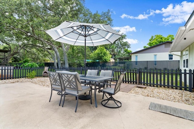 20 Putnam Ave, Ormond Beach, FL 32174 - fenced backyard with a patio area and outdoor dining space