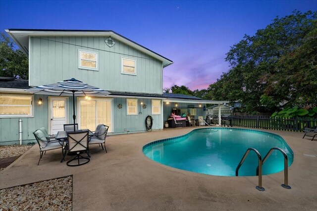 20 Putnam Ave, Ormond Beach, FL 32174 - pool at dusk with a patio area