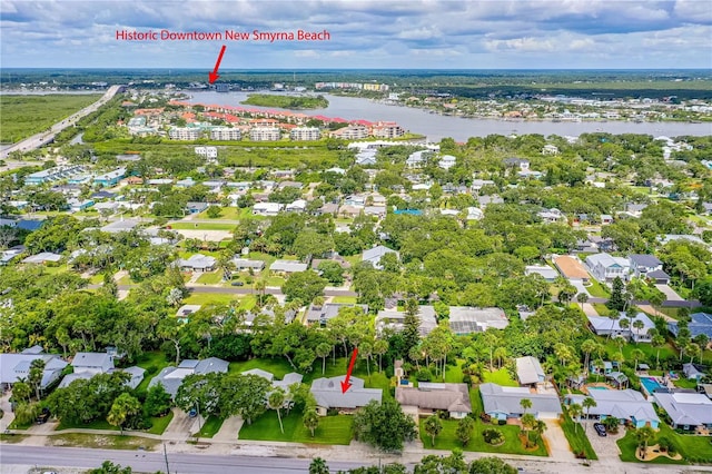 aerial overview of property's location featuring a nearby body of water and nearby suburban area