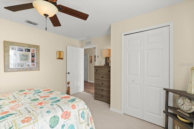 318 Two Oaks Dr, Edgewater, FL 32141 - bedroom with a closet, light carpet, and ceiling fan