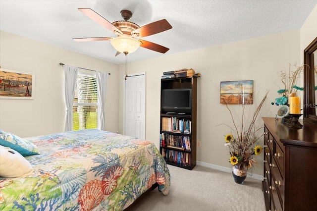318 Two Oaks Dr, Edgewater, FL 32141 - bedroom featuring light colored carpet, a closet, and ceiling fan