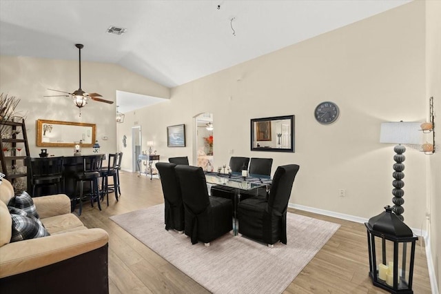 318 Two Oaks Dr, Edgewater, FL 32141 - dining room featuring a ceiling fan, vaulted ceiling, and light wood-style flooring
