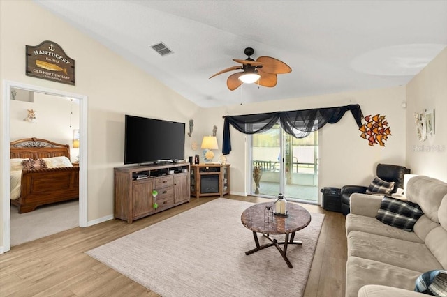 318 Two Oaks Dr, Edgewater, FL 32141 - living area featuring a ceiling fan, light wood-style floors, and vaulted ceiling