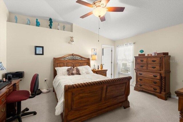 318 Two Oaks Dr, Edgewater, FL 32141 - bedroom featuring vaulted ceiling, light carpet, and ceiling fan