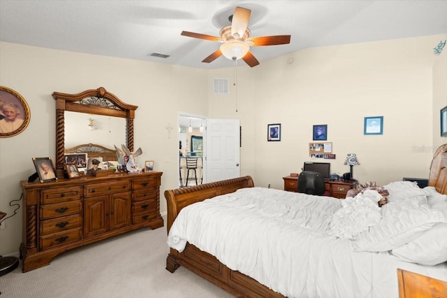 318 Two Oaks Dr, Edgewater, FL 32141 - bedroom featuring light carpet, vaulted ceiling, and a ceiling fan