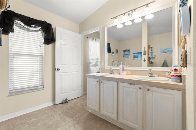 318 Two Oaks Dr, Edgewater, FL 32141 - bathroom with double vanity and tile patterned flooring