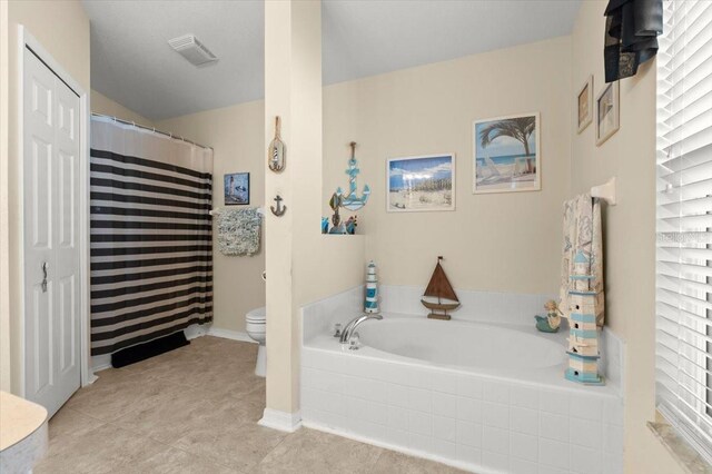 318 Two Oaks Dr, Edgewater, FL 32141 - full bath featuring a bath, tile patterned floors, and vaulted ceiling