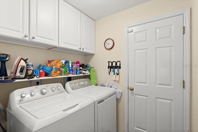 318 Two Oaks Dr, Edgewater, FL 32141 - laundry area featuring independent washer and dryer, cabinet space, and a textured ceiling