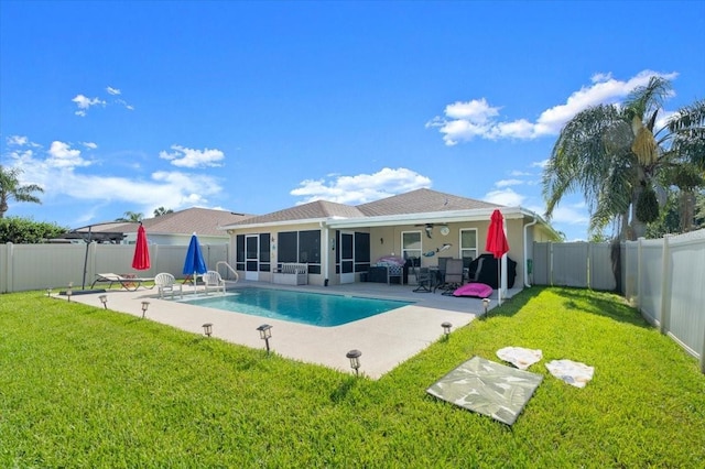 318 Two Oaks Dr, Edgewater, FL 32141 - back of property featuring ceiling fan, a fenced backyard, a patio, and a sunroom