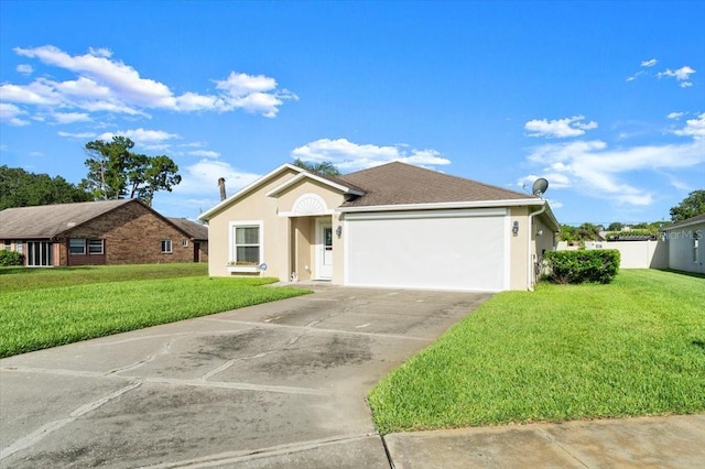 318 Two Oaks Dr, Edgewater, FL 32141 - ranch-style house featuring a garage, driveway, a front yard, and stucco siding