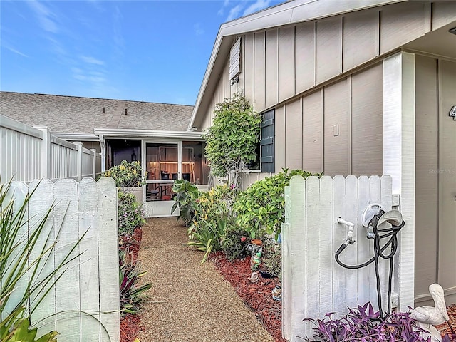 44 Fore Dr, New Smyrna Beach, FL 32168 - doorway to property with board and batten siding and roof with shingles