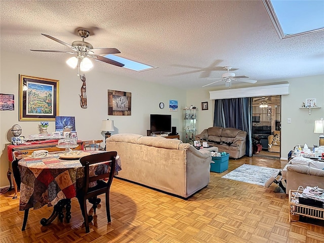 44 Fore Dr, New Smyrna Beach, FL 32168 - living area with a skylight, a ceiling fan, and a textured ceiling