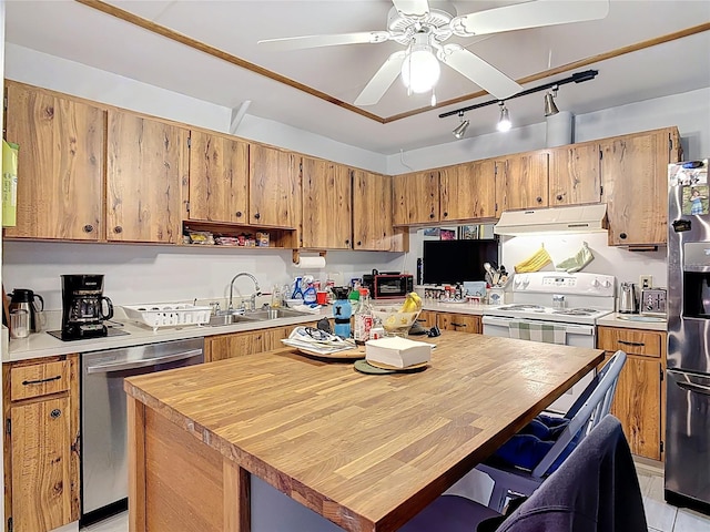 44 Fore Dr, New Smyrna Beach, FL 32168 - kitchen featuring under cabinet range hood, dishwasher, white electric range oven, fridge, and track lighting