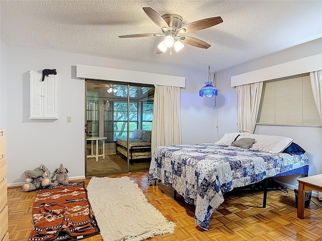 44 Fore Dr, New Smyrna Beach, FL 32168 - bedroom with a textured ceiling, access to outside, and a ceiling fan