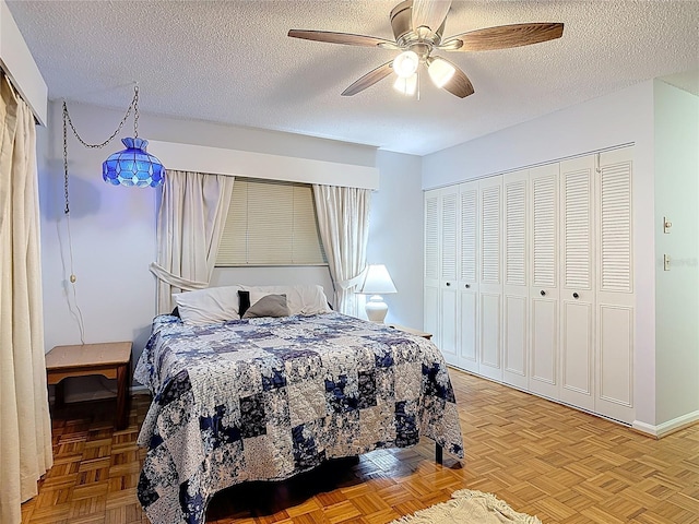 44 Fore Dr, New Smyrna Beach, FL 32168 - bedroom featuring a textured ceiling, ceiling fan, and a closet