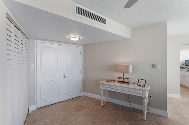 2625 S Atlantic Ave Unit 28Se, Daytona Beach Shores, FL 32118 - foyer with a textured ceiling and ceiling fan