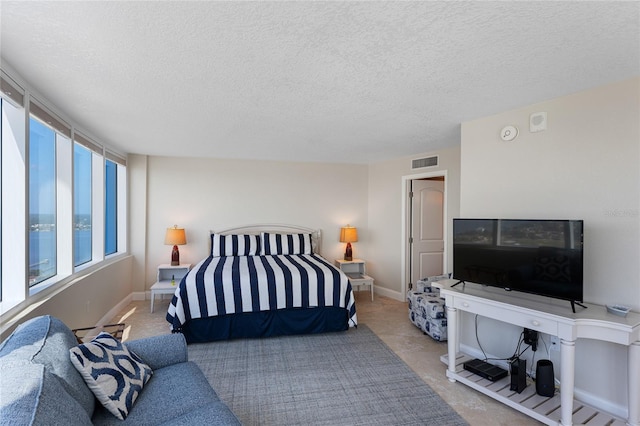 2625 S Atlantic Ave Unit 28Se, Daytona Beach Shores, FL 32118 - bedroom with a textured ceiling and baseboard heating