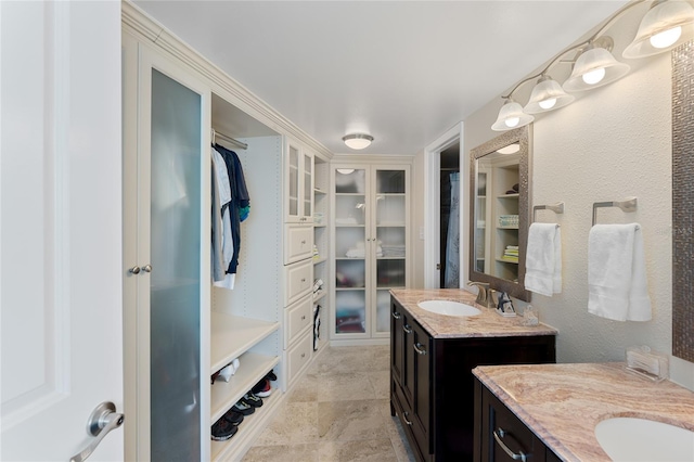 2625 S Atlantic Ave Unit 28Se, Daytona Beach Shores, FL 32118 - full bathroom with two vanities and a walk in closet