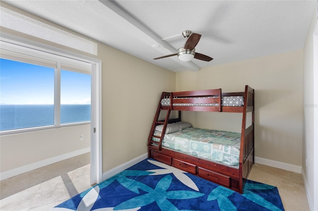 2625 S Atlantic Ave Unit 28Se, Daytona Beach Shores, FL 32118 - bedroom with ceiling fan and a water view