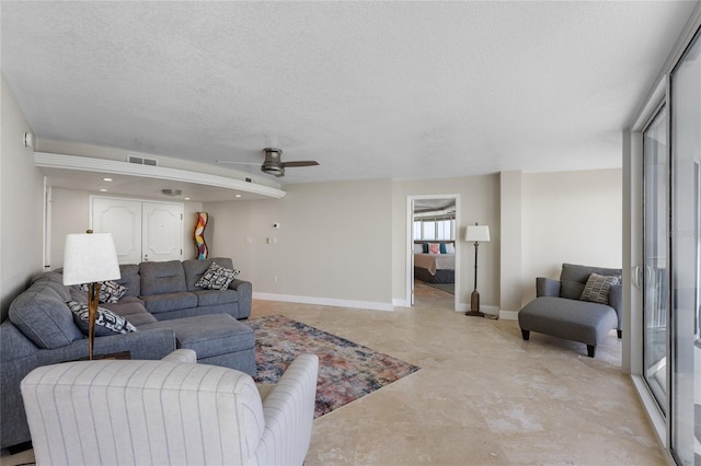 2625 S Atlantic Ave Unit 28Se, Daytona Beach Shores, FL 32118 - living area featuring ceiling fan, finished concrete floors, a textured ceiling, and recessed lighting