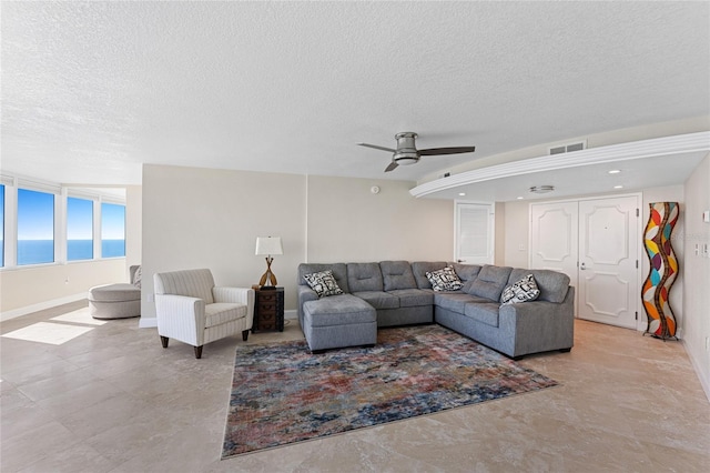 2625 S Atlantic Ave Unit 28Se, Daytona Beach Shores, FL 32118 - living room featuring a textured ceiling and ceiling fan
