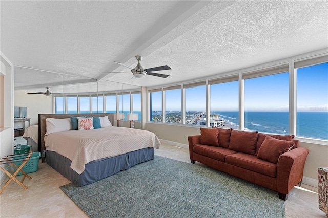 2625 S Atlantic Ave Unit 28Se, Daytona Beach Shores, FL 32118 - bedroom featuring a water view, multiple windows, ceiling fan, and a textured ceiling