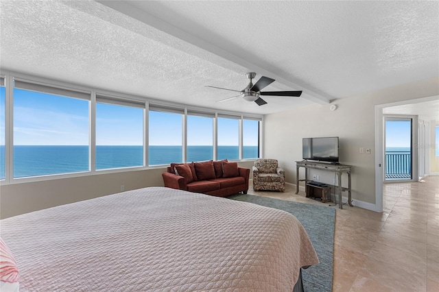 2625 S Atlantic Ave Unit 28Se, Daytona Beach Shores, FL 32118 - bedroom featuring multiple windows, a ceiling fan, and a textured ceiling