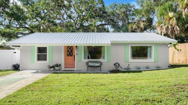 129 Rogers Pl, Port Orange, FL 32127 - single story home with stucco siding, a metal roof, and driveway