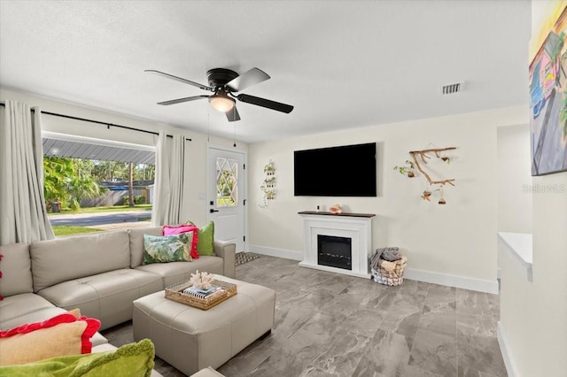 129 Rogers Pl, Port Orange, FL 32127 - living area with ceiling fan, marble finish flooring, and a fireplace