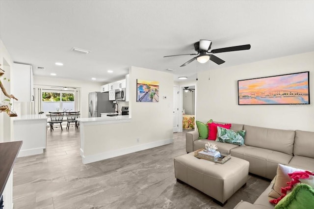 129 Rogers Pl, Port Orange, FL 32127 - living room featuring ceiling fan and recessed lighting