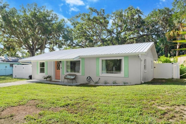 129 Rogers Pl, Port Orange, FL 32127 - ranch-style house with a metal roof, stucco siding, and a standing seam roof