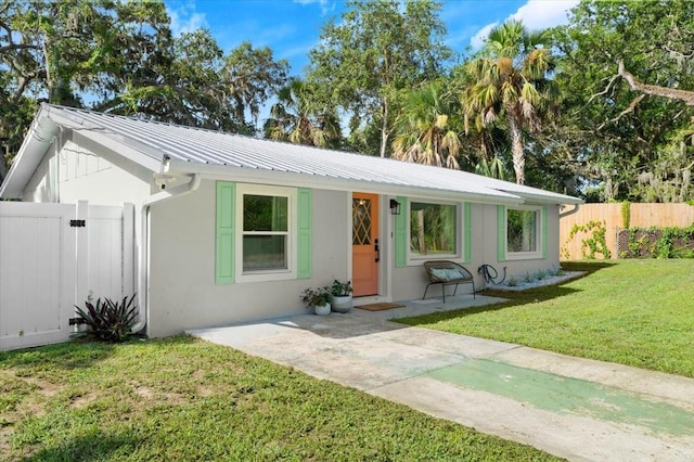 129 Rogers Pl, Port Orange, FL 32127 - ranch-style house featuring stucco siding and a metal roof