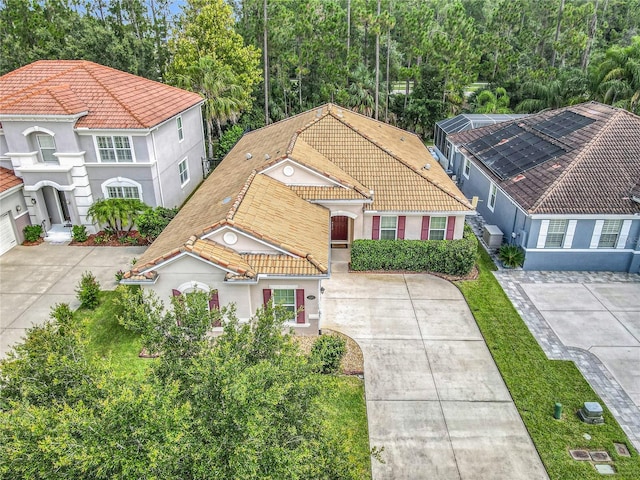 3361 Pegaso Ave, New Smyrna Beach, FL 32168 - view of front facade featuring a tiled roof, stucco siding, and concrete driveway